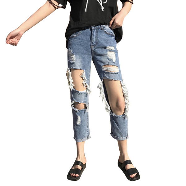 Γυναικεία τζιν με σχισμένα γόνατα και ψηλή μέση