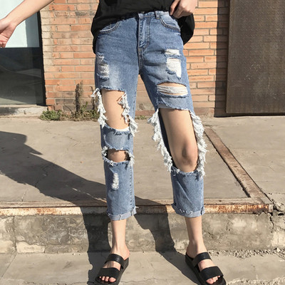 Γυναικεία τζιν με σχισμένα γόνατα και ψηλή μέση