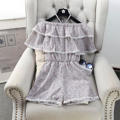 Οι γυναίκες φρέσκα αμάνικο jumpsuit και floral