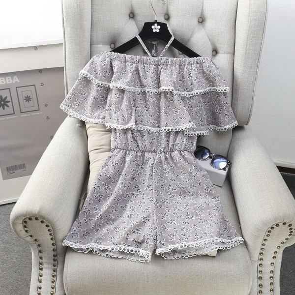 Οι γυναίκες φρέσκα αμάνικο jumpsuit και floral