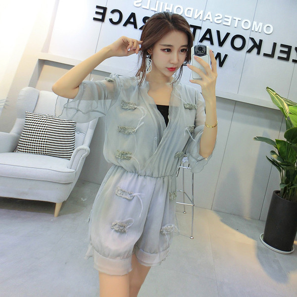 Σύντομη κυρίες jumpsuit με διαφανή μανίκια πλέγματος