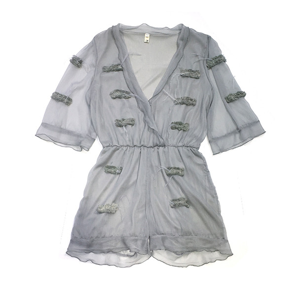 Σύντομη κυρίες jumpsuit με διαφανή μανίκια πλέγματος