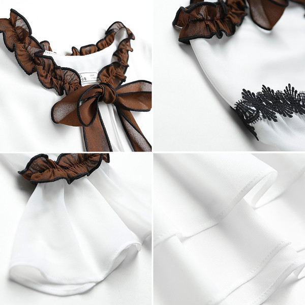 Κομψό κυρίες πουκάμισο με 3/4 μανίκια σε ένα ευρύ σχέδιο σε λευκό