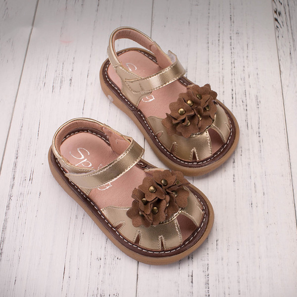 Παιδικά σανδάλια για τα κορίτσια σε χρυσό και μπλε διακόσμηση λουλούδι