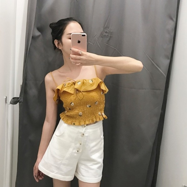 Σύντομη κυρίες μπουστάκι με λεπτές τιράντες σε κίτρινο και λευκό