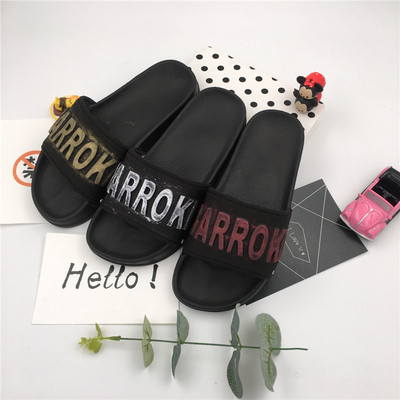 Красиви и модерни гумени чехли за дамите в черен цвят, с цветен надпис