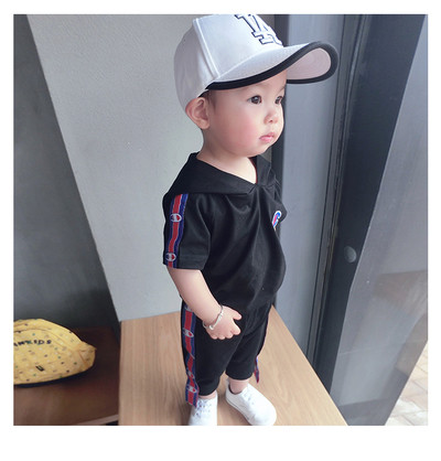 Αθλητικό σετ για αγόρια σε μαύρο και άσπρο - κοντά μανίκια και παντελόνια