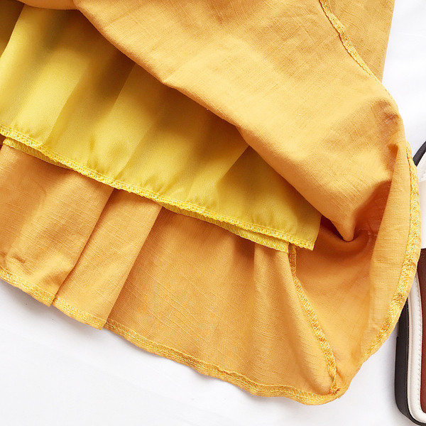 Φρέσκα κυρία φόρεμα με κορδέλα σε κίτρινο, πράσινο και λευκό