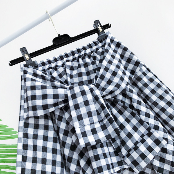 Κομψό κυρίες φούστα καρό δέσιμο μέρος