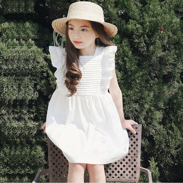 Κομψή παιδιά ντύνονται για τα κορίτσια σε λευκό και σκούρο μπλε χρώμα