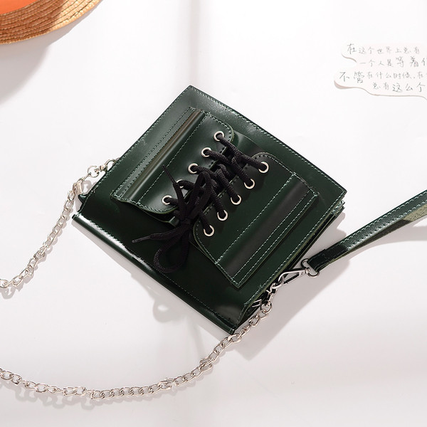 Стилна дамска чанта в четири цвята с метална дръжка и с връзки