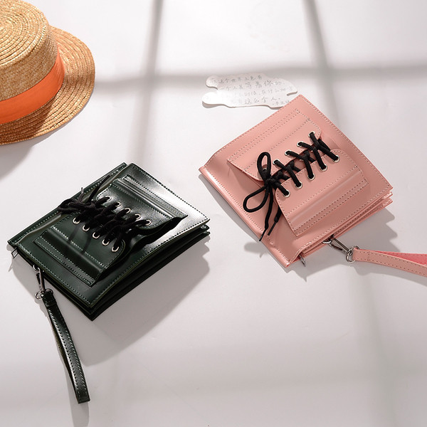 Стилна дамска чанта в четири цвята с метална дръжка и с връзки