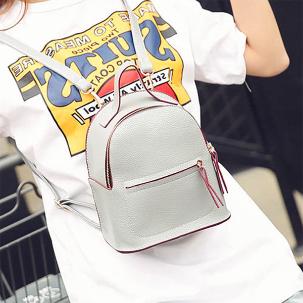 Μικρό γυναικείο σακίδιο σε καθαρό σχέδιο και σε τρία χρώματα