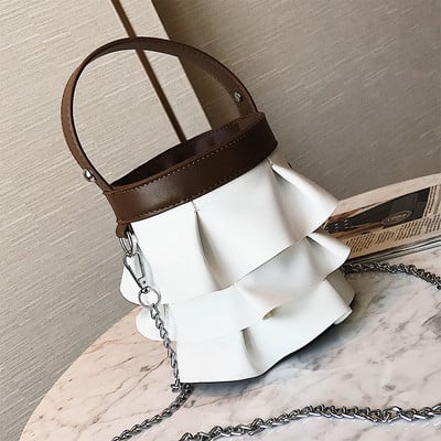 Интересен модел дамска чанта с метална дръжка в три цвята