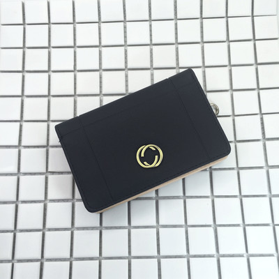 Красиво дамско портмоне в шест цвята с малка метална декорация