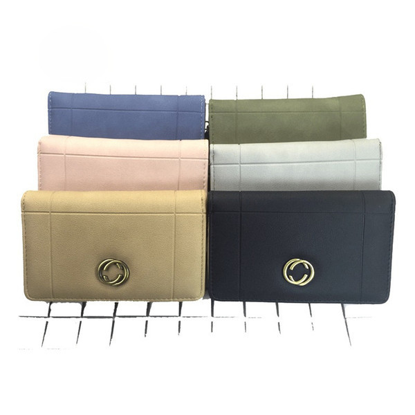 Красиво дамско портмоне в шест цвята с малка метална декорация