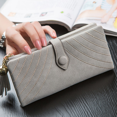 Стилен дамски портфейл с пискюл и копче в пет цвята