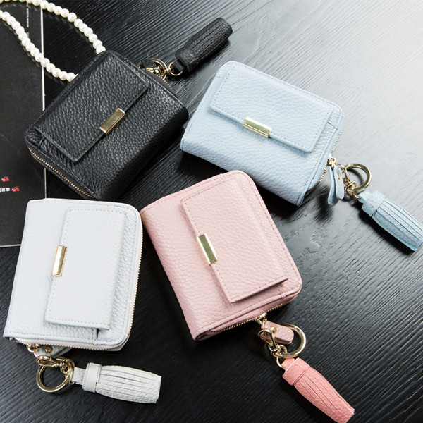 Красив мини дамски портфейл с пискюл в свежи цветове