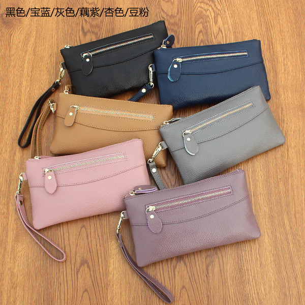 Дамски портфейл с ципове и с дръжка в няколко цвята