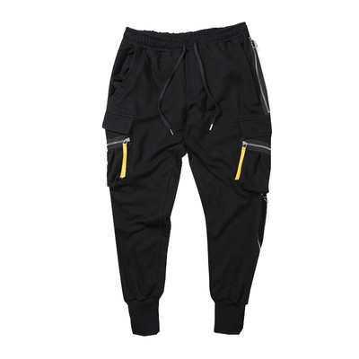 Κομψά ανδρικά παντελόνια σε ευρύ σχέδιο με τσέπες και φερμουάρ