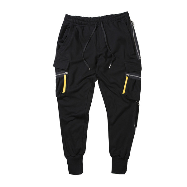 Κομψά ανδρικά παντελόνια  σε ευρύ σχέδιο με τσέπες και φερμουάρ