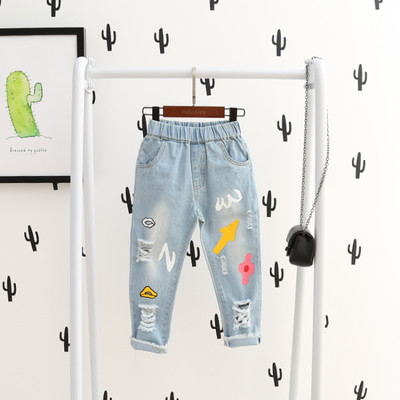 Красиви детски дънки за момичета с цветен десен, накъсани и с висока ластична талия