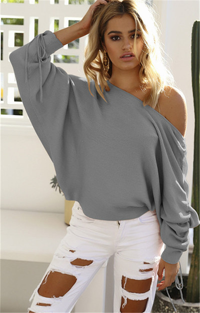 Γυναικεία κομψή καθημερινή μπλούζα με πτώση ώμου και ένα ενδιαφέρον μανίκι με κορδόνια