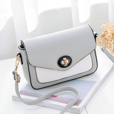 Κομψό γυναικείο μίνι σακίδιο με μακρύ ιμάντα ώμου και ενδιαφέρουσα πόρπη για στερέωση