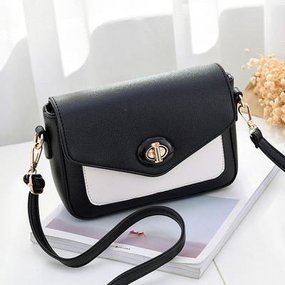 Κομψό γυναικείο μίνι σακίδιο με μακρύ ιμάντα ώμου και ενδιαφέρουσα πόρπη για στερέωση