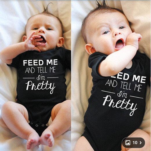 Παιδικό ολόσωμο σε λευκό και μαύρο χρώμα με επιγραφή