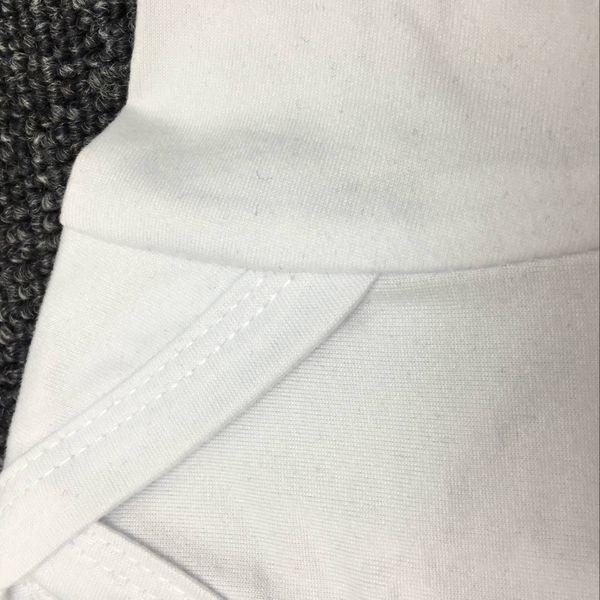 Παιδικό ολόσωμο σε λευκό και μαύρο χρώμα με επιγραφή