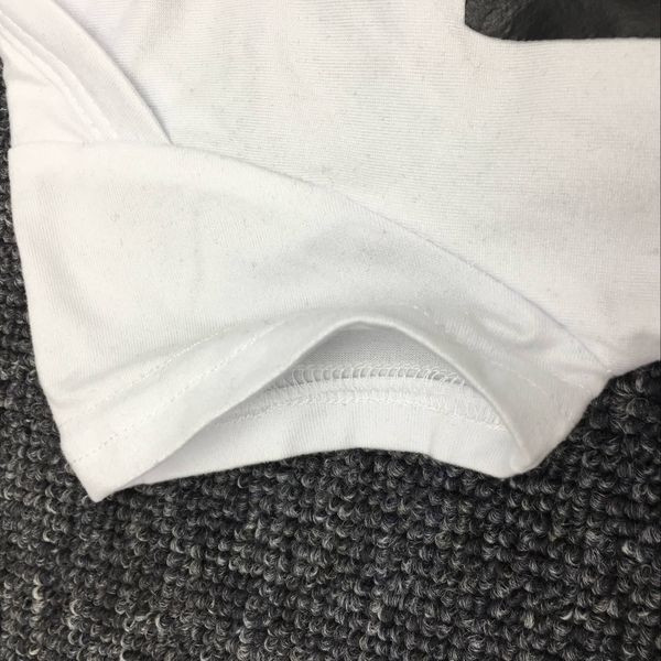 Παιδικό ολόσωμο σε λευκό και μαύρο χρώμα με επιγραφή