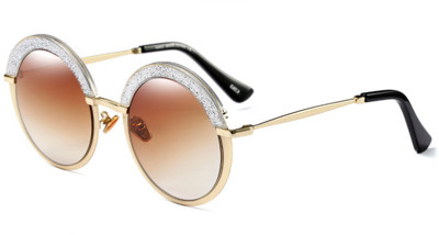 Γυναικεία γυαλιά με κυκλικό σχήμα γυαλιού και ενδιαφέροντα λαμπερά βότσαλα