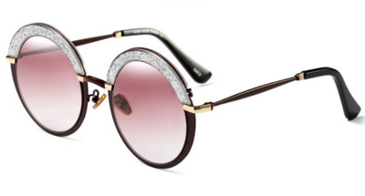 Γυναικεία γυαλιά με κυκλικό σχήμα γυαλιού και ενδιαφέροντα λαμπερά βότσαλα