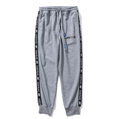 Стилен спортен панталон в свободен модел с надписи в два цвята