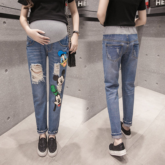 Сладки ежедневни дънки за бременни жени с накъсан мотив и аликации на анимационни изображения