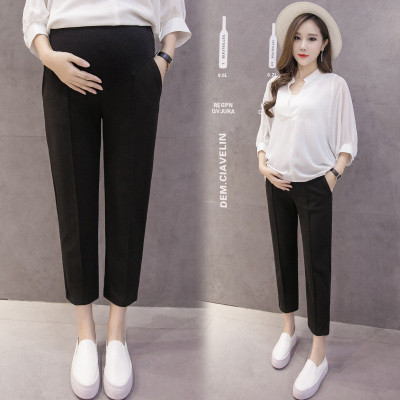 Κομψά παντελόνια 7/8 για έγκυες γυναίκες σε μαύρο και μπεζ χρώμα