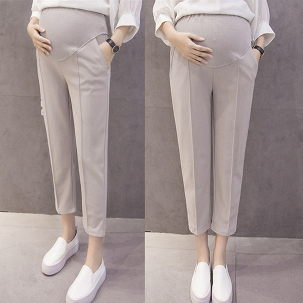 Κομψά παντελόνια 7/8 για έγκυες γυναίκες σε μαύρο και μπεζ χρώμα