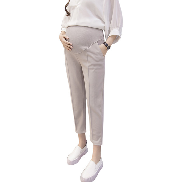 Κομψά παντελόνια 7/8 για έγκυες γυναίκες σε μαύρο και μπεζ χρώμα