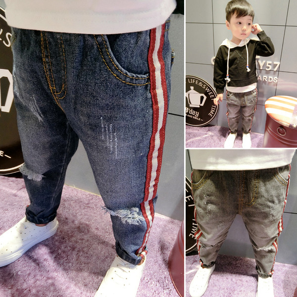 Стилни детски дънки - накъсани с ленти, в два цвята