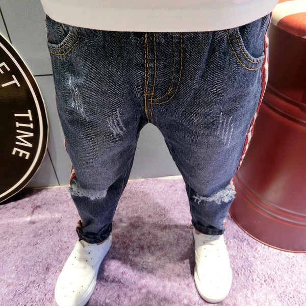 Стилни детски дънки - накъсани с ленти, в два цвята