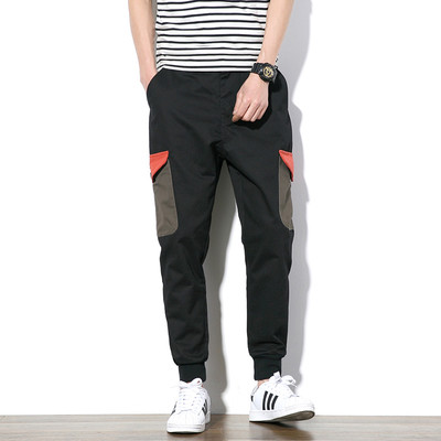 Αθλητικά αντρικά παντελόνια σε ευρύ σχέδιο με τσέπες