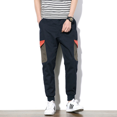 Αθλητικά αντρικά παντελόνια σε ευρύ σχέδιο με τσέπες