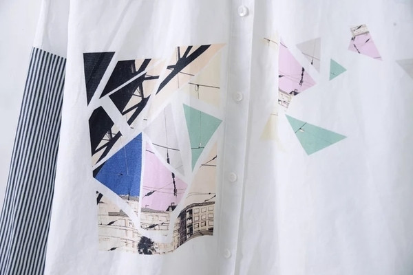 Ένα ενδιαφέρον γυναικείο πουκάμισο για το φθινοπωρινό με λωρίδα και μανίκια