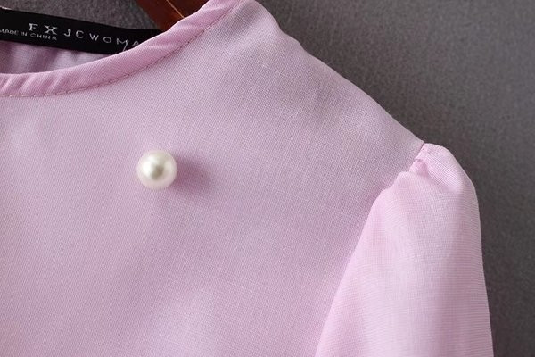 Γλυκιά γυναικεία μπλούζα με μανίκια 3/4 και διακοσμητικά σφαιρίδια