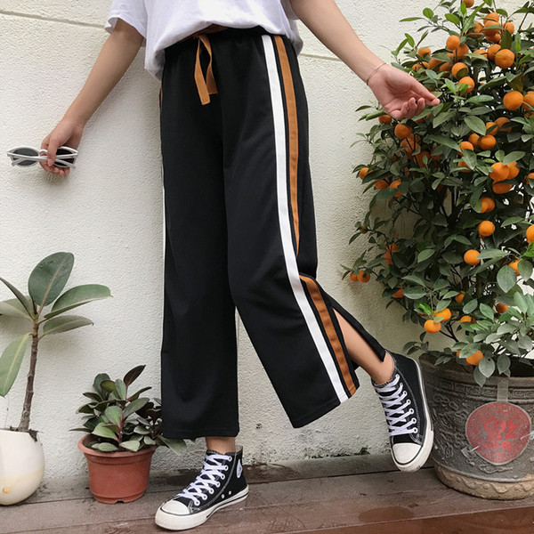 Κομψά γυναικεία παντελόνια σε μαύρο χρώμα με χρωματιστές λωρίδες