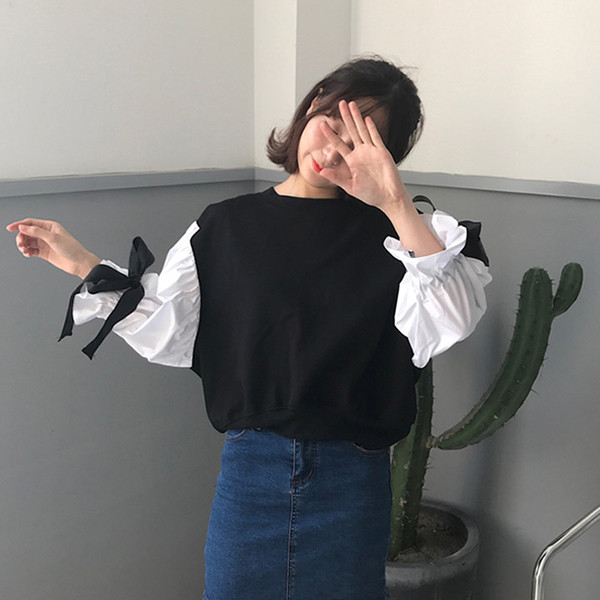 Κομψή γυναικεία μπλούζα σε ευρύ μοτίβο με κορδέλες