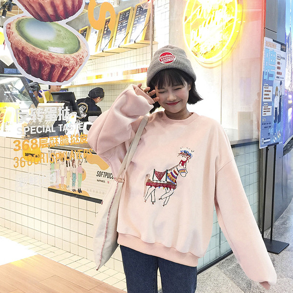 Ευρύ γυναικείο πουλόβερ  σε μαύρο και ροζ με applicqué