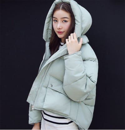 Μεγάλο χειμωνιάτικο γυναικείο μπουφάν με τσέπες και κουκούλα σε διάφορα σχέδια και χρώματα