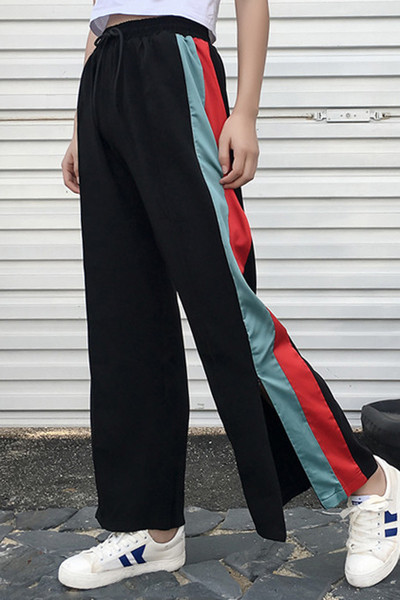Спортно-елегантен дамски панталон - разкроен с цветни ленти